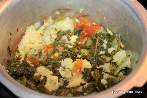 making kale-mung bean curry