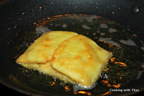 frying coconut crepe with chicken filling