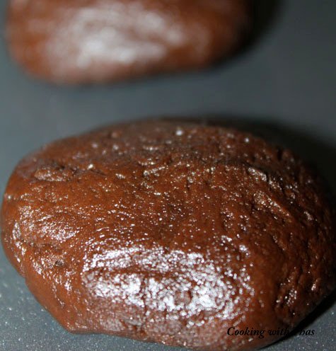 Chocolate cookies into the oven