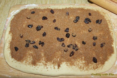 Dough topped with cinnamon-raisin mix