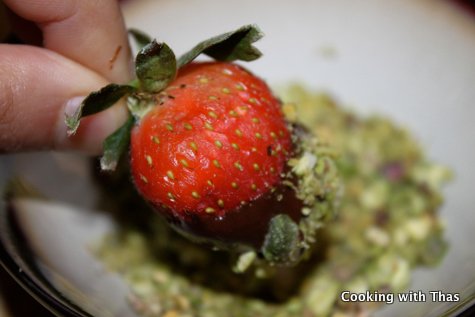 chocolate covered strawberry dipped in pistachios
