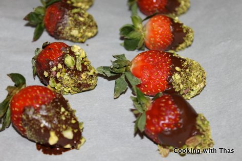 chocolate pistachios covered strawberries setting