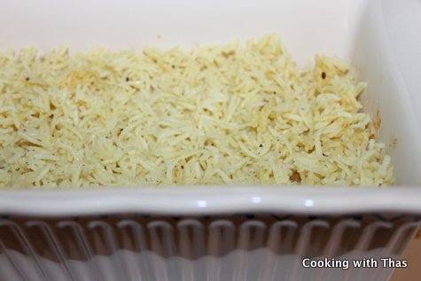 layering fried chicken biryani
