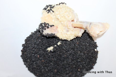 chicken lollipop coated with black sesame seeds