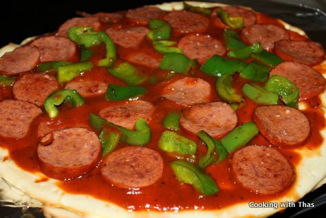 pizza with salami and green pepper topping