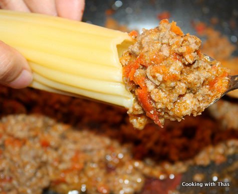 stuffing manicotti