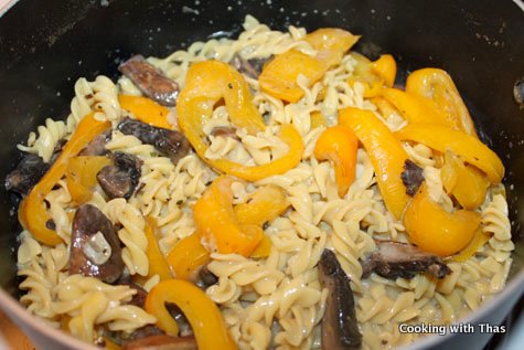 pasta mixed with creamy mushroom sauce