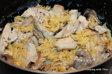 making pasta and chicken in white sauce