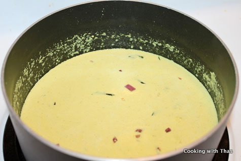 making-poached egg korma