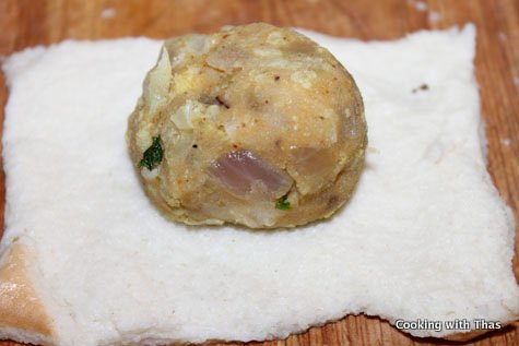 stuffing cauliflower patties in bread