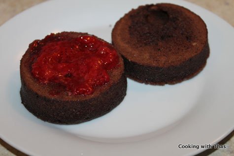 spreading strawberry syrup