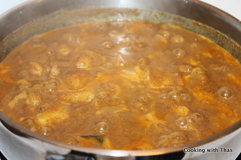 making shrimp and potato curry