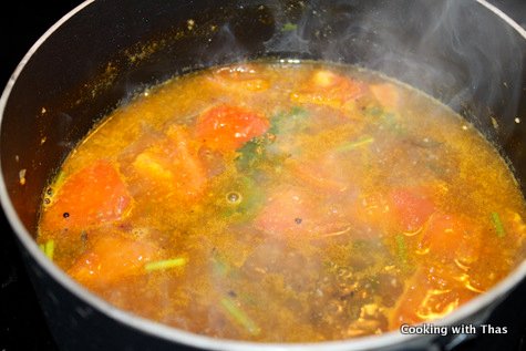 making tomato rasam
