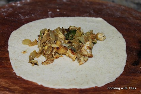placing the chicken on dough