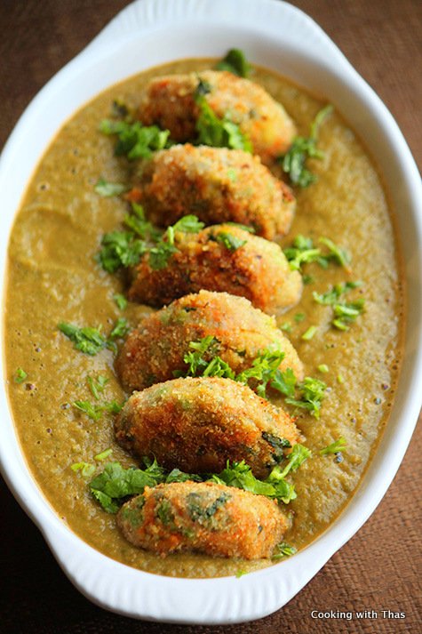 Veggie cutlet in tomato spinach gravy